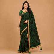 Dark green Bandhani print georgette saree with tassel pallu